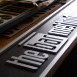 The Bar Method Fascia sign - still on the table